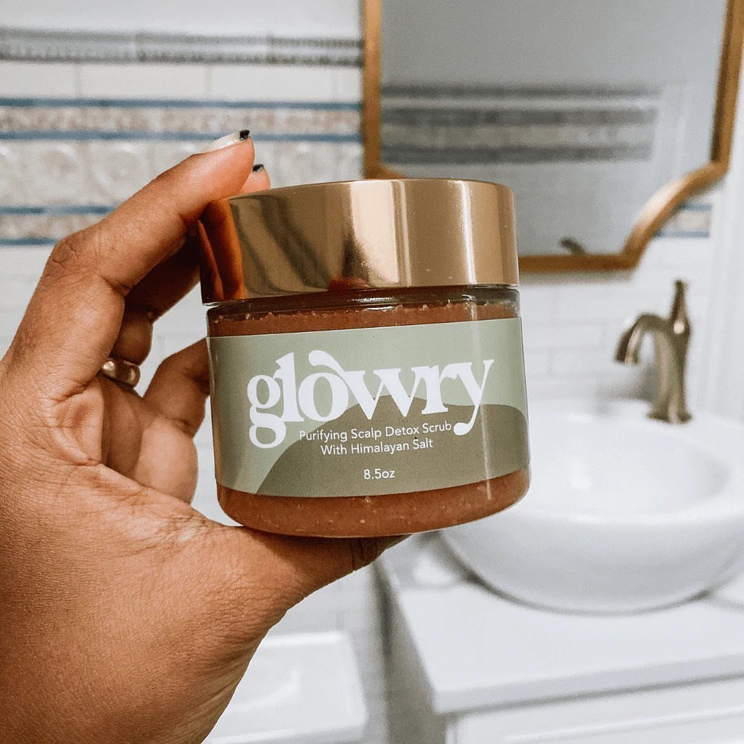 Glowry Purifying Scalp Detox Scrub with Himalayan Salt jar held in a hand.