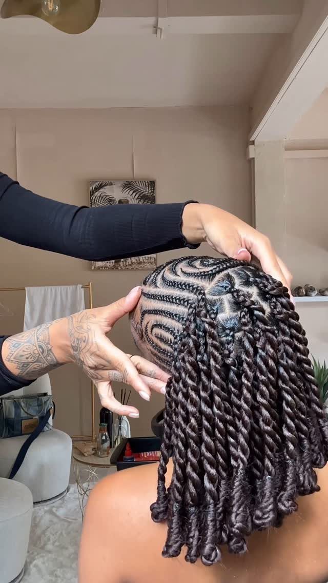 Intricate scalp braids transitioning into thick rope twists on a person's head.