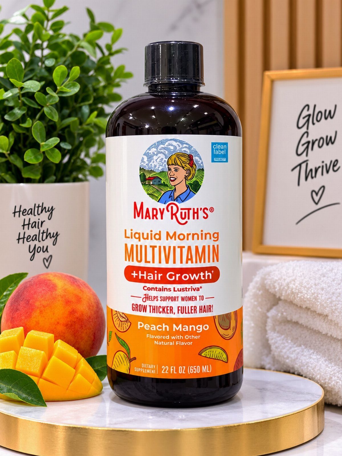 Mary Ruth's Liquid Morning Multivitamin bottle with mango and peach on marble pedestal